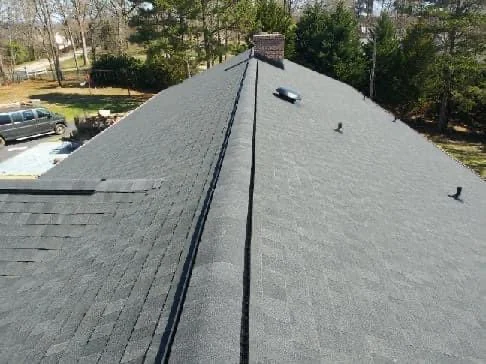 Rooftop shingle roof with chimney - roof access systems nyc by Local Law 11 Masonry Contractors NYC