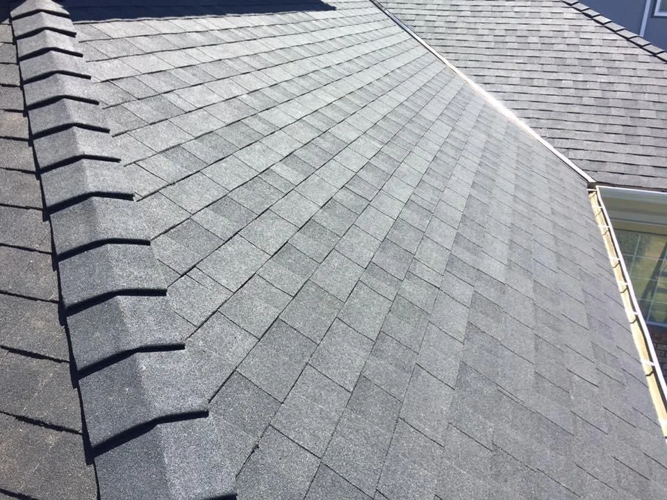 Newly installed shingle roof edge with drip flashing