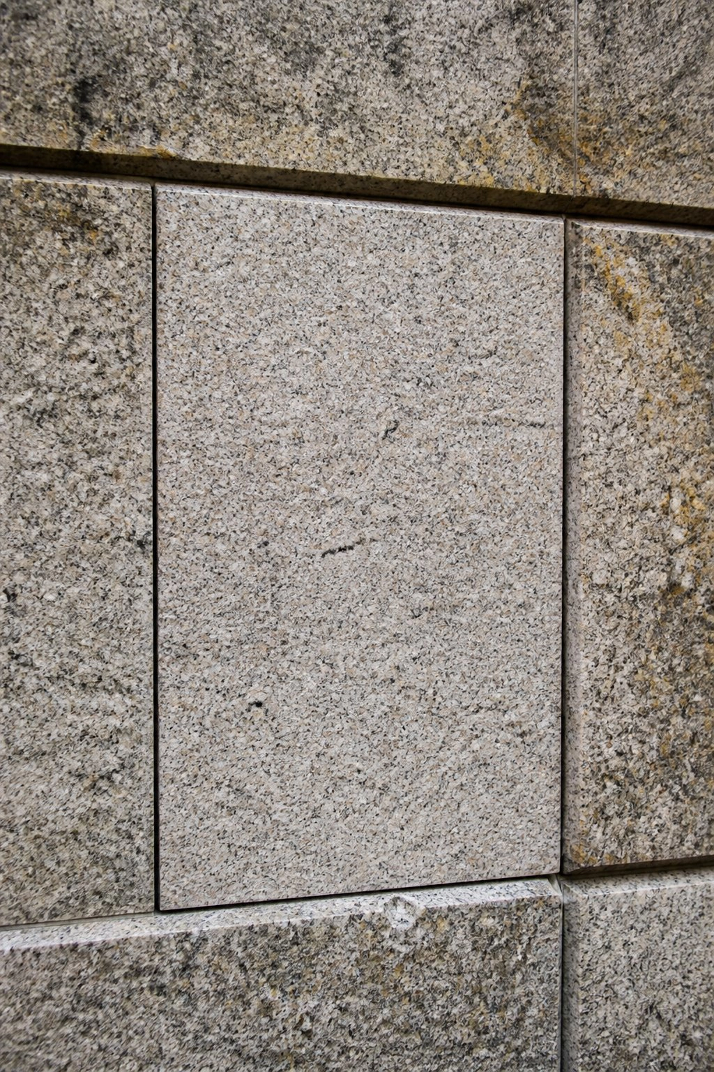 Close-up of granite stone facade panel joints - Facade Restoration NYC by Local Law 11 Masonry Contractors NYC